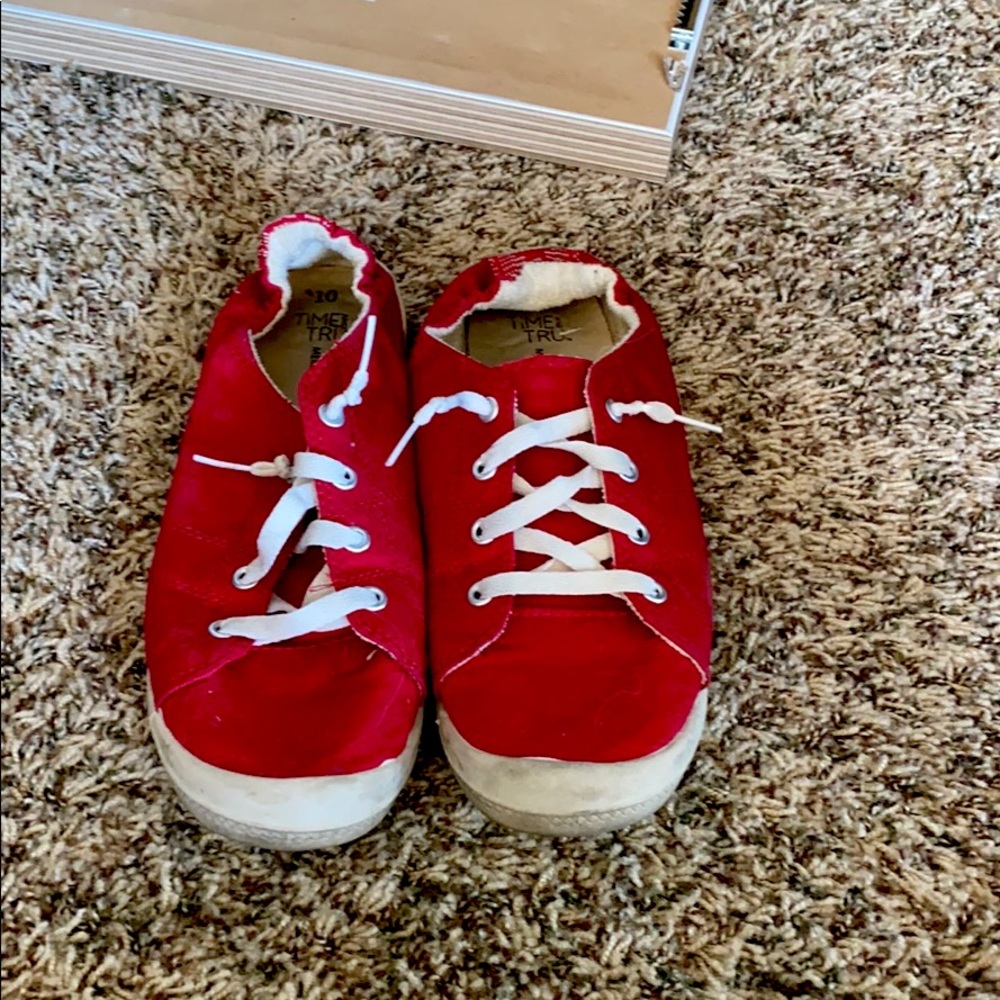 Red slip on sneakers